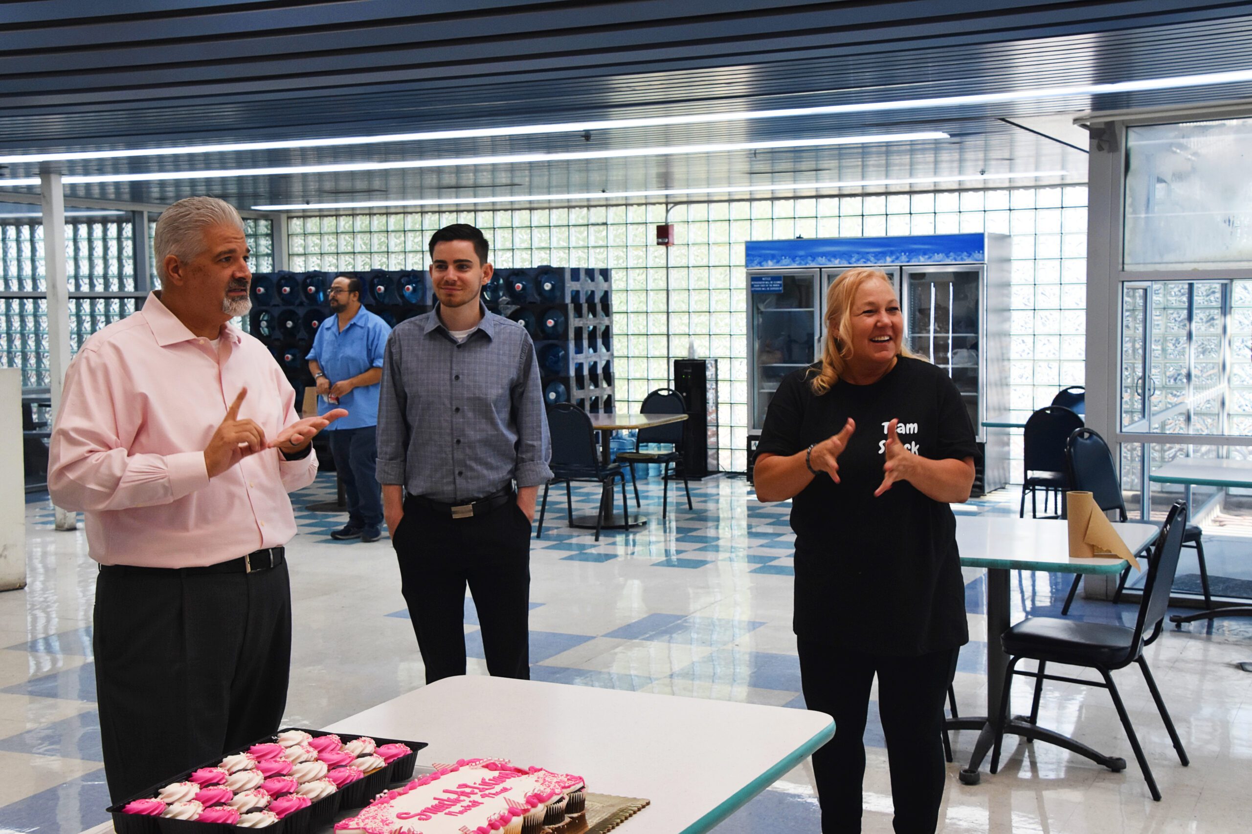 the Staff gives a speach at the new site inside the post office