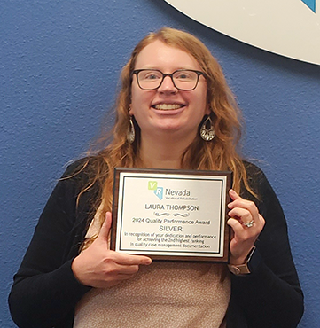 Laura Thompson holds her silver QC award