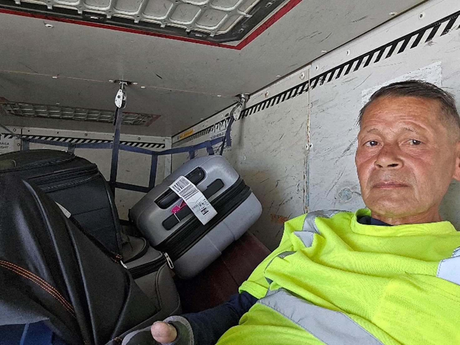 Walter in the cargo hold of a plane