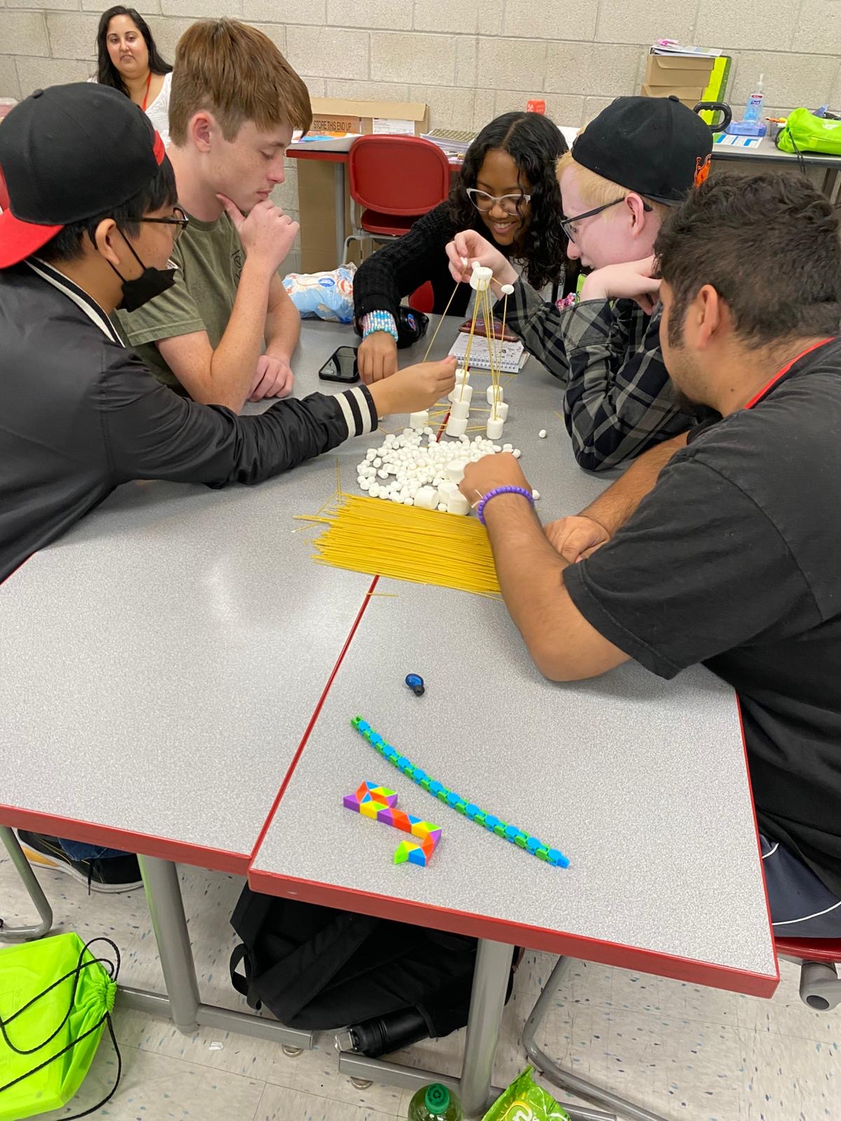 campers work on a project together