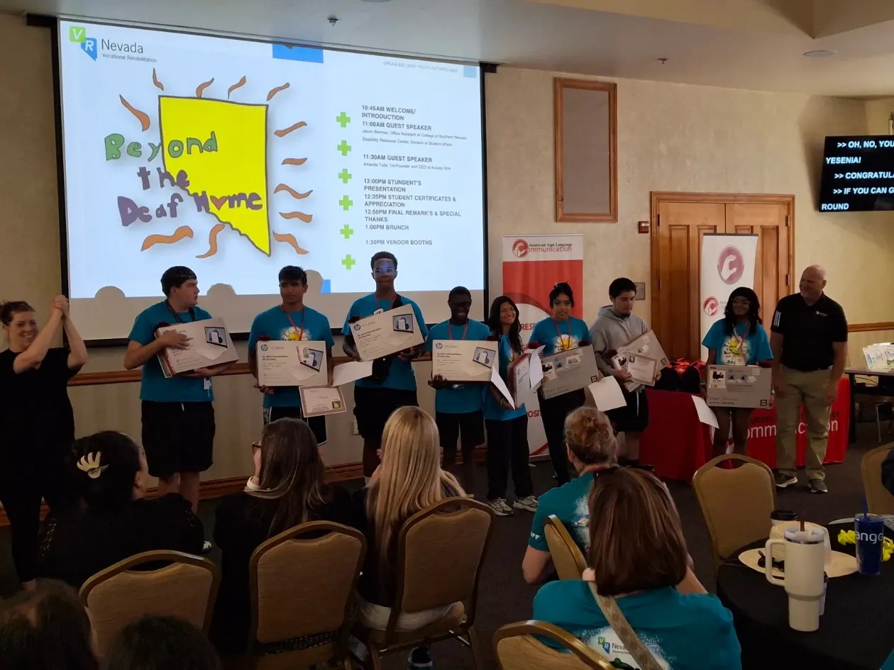 students recieving laptops